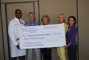 Dr. Colin Weekes, left, from the University of Colorado Cancer Center, accepts a $45,000 check from Jim Comferford, Maureen Shul, Stacy Ohlsson and Melanie Avner. The money represents proceeds from the recent Wings of Hope gala and will be put toward pancreatic cancer research and treatment programs at the Anschutz Medical Campus.  