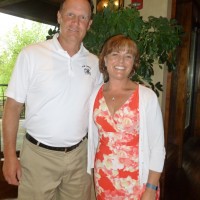 Event emcee/honorary chair Troy Calhoun with THFC's executive director April Speake