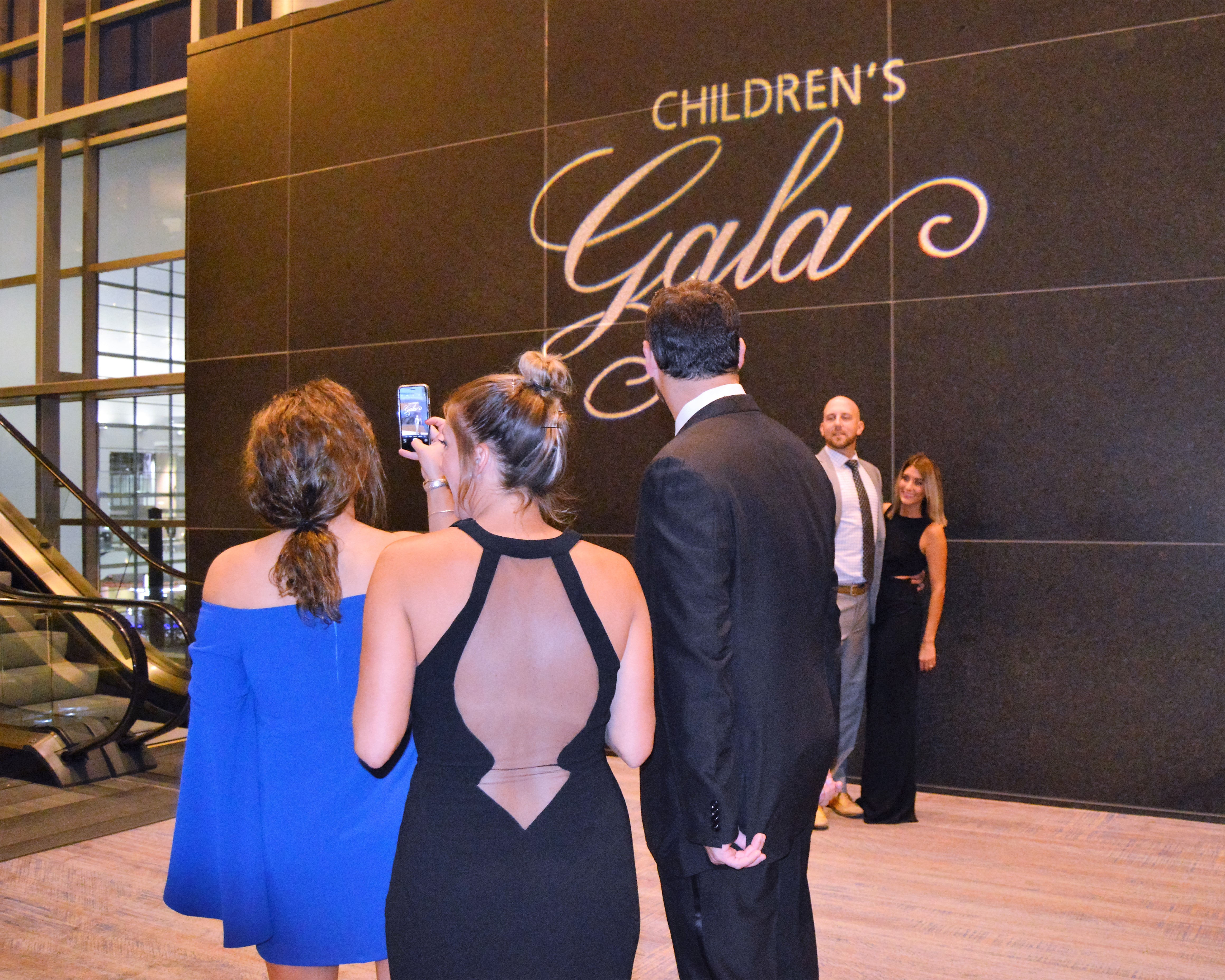 The Children's Gala logo is the perfect spot for a photo.