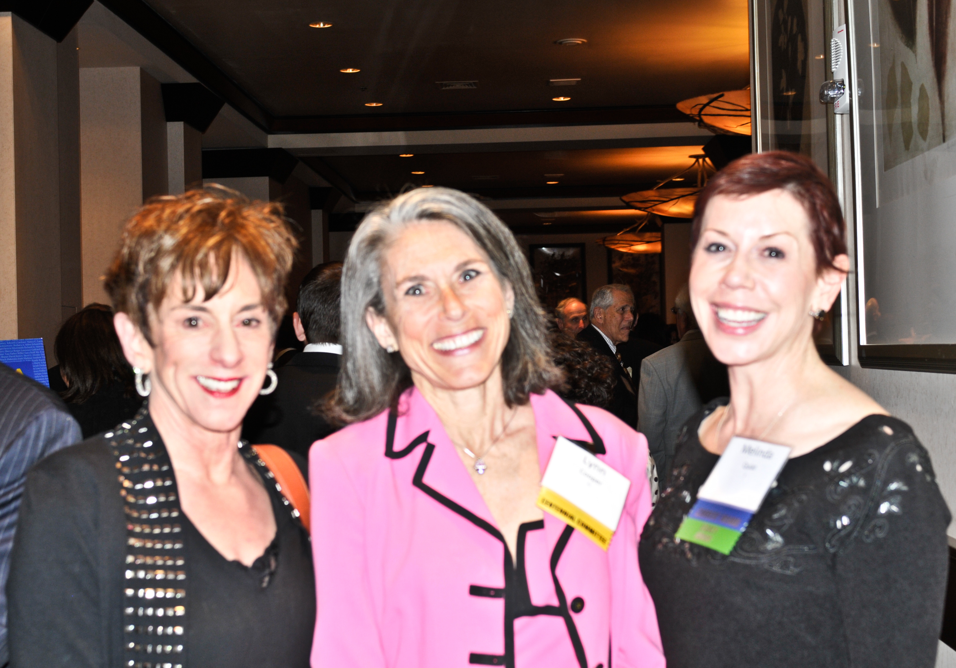 Mary McGee, left, Lynn Cooper (dinner committee) and Melinda Quiat (board)