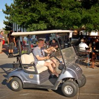 Golfer in Golf Cart Returning_0080