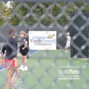 A look through the fence and into the court at Tennis with the Stars