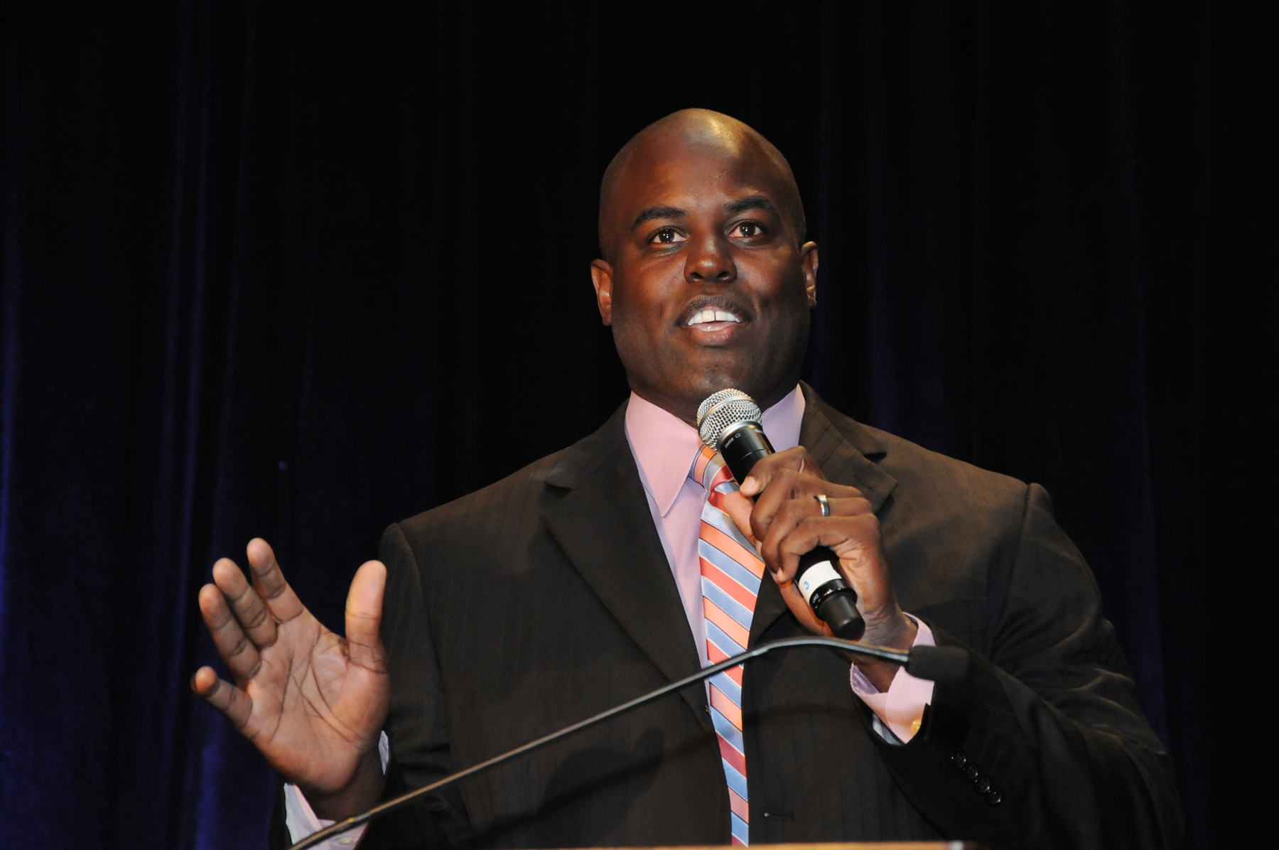 Reggie Rivers, a former Denver Bronco, auctioneer