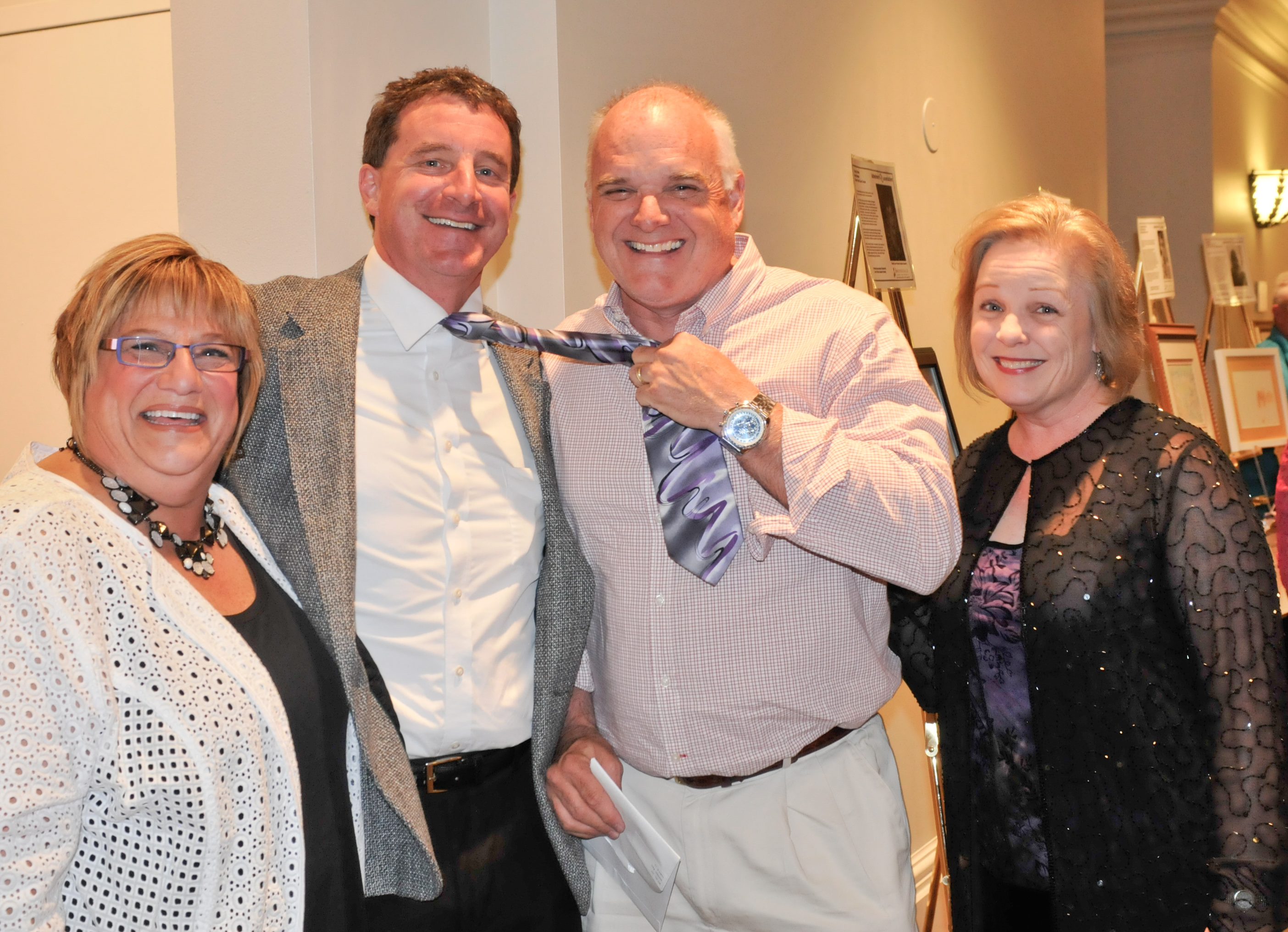 Robin Patterson, left, Phil Stafford, lending part of his tie to Ken ...