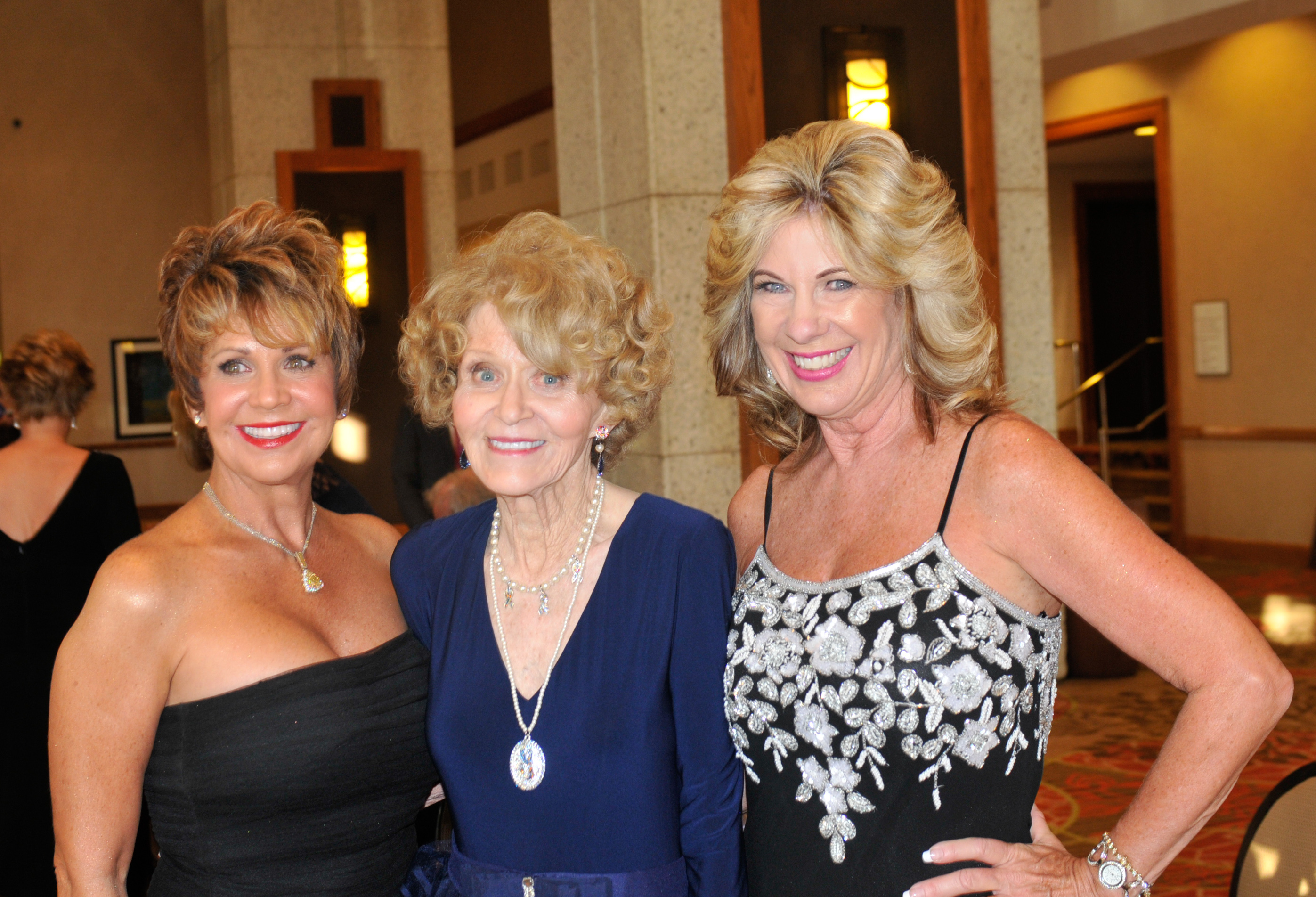 CoChairs Gayle Novak and Terri Fisher flank honoree Sandee Walling