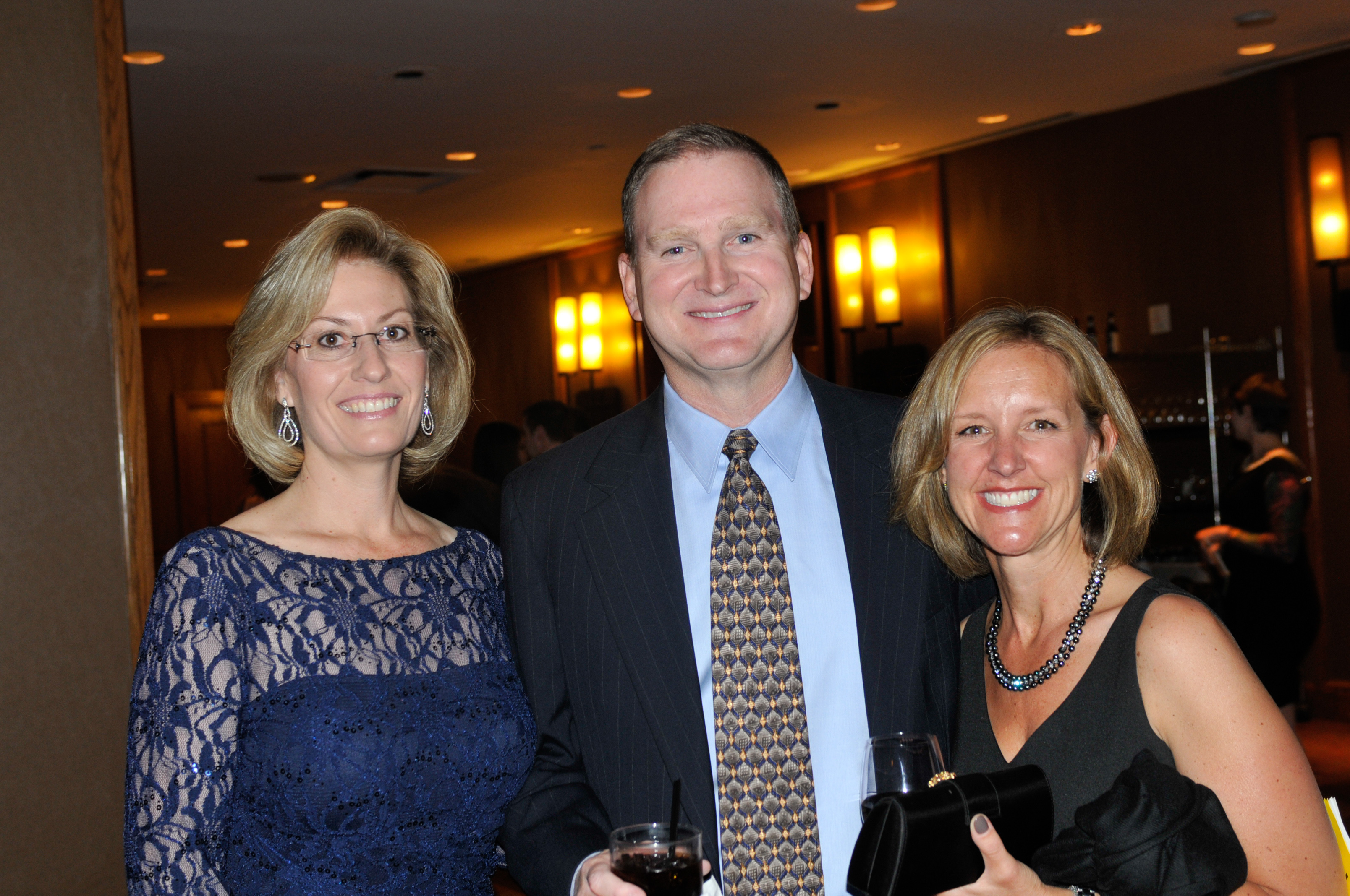 Gina Berg, left, Bob and Amy Shanahan