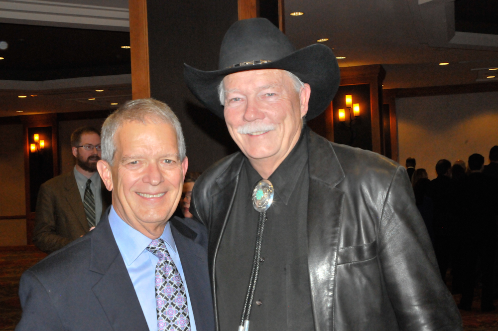 Jim Dierker, left, and auctioneer Gary Corbett