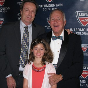 Rick and Susan Kreutzer take a photo with Honoree Art Thomson, center