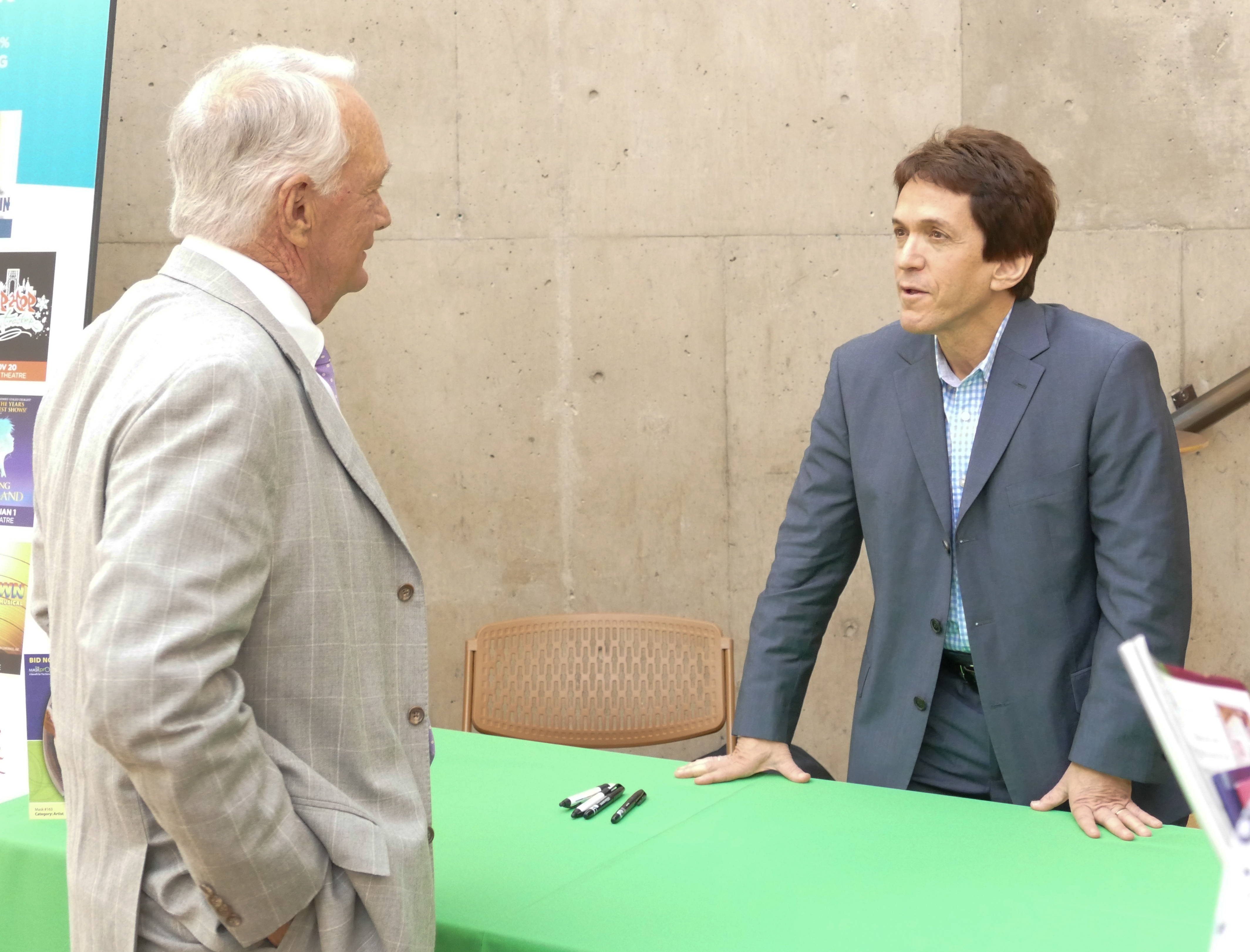 Skip Miller, right, chats with Mitch Albom before his book signing