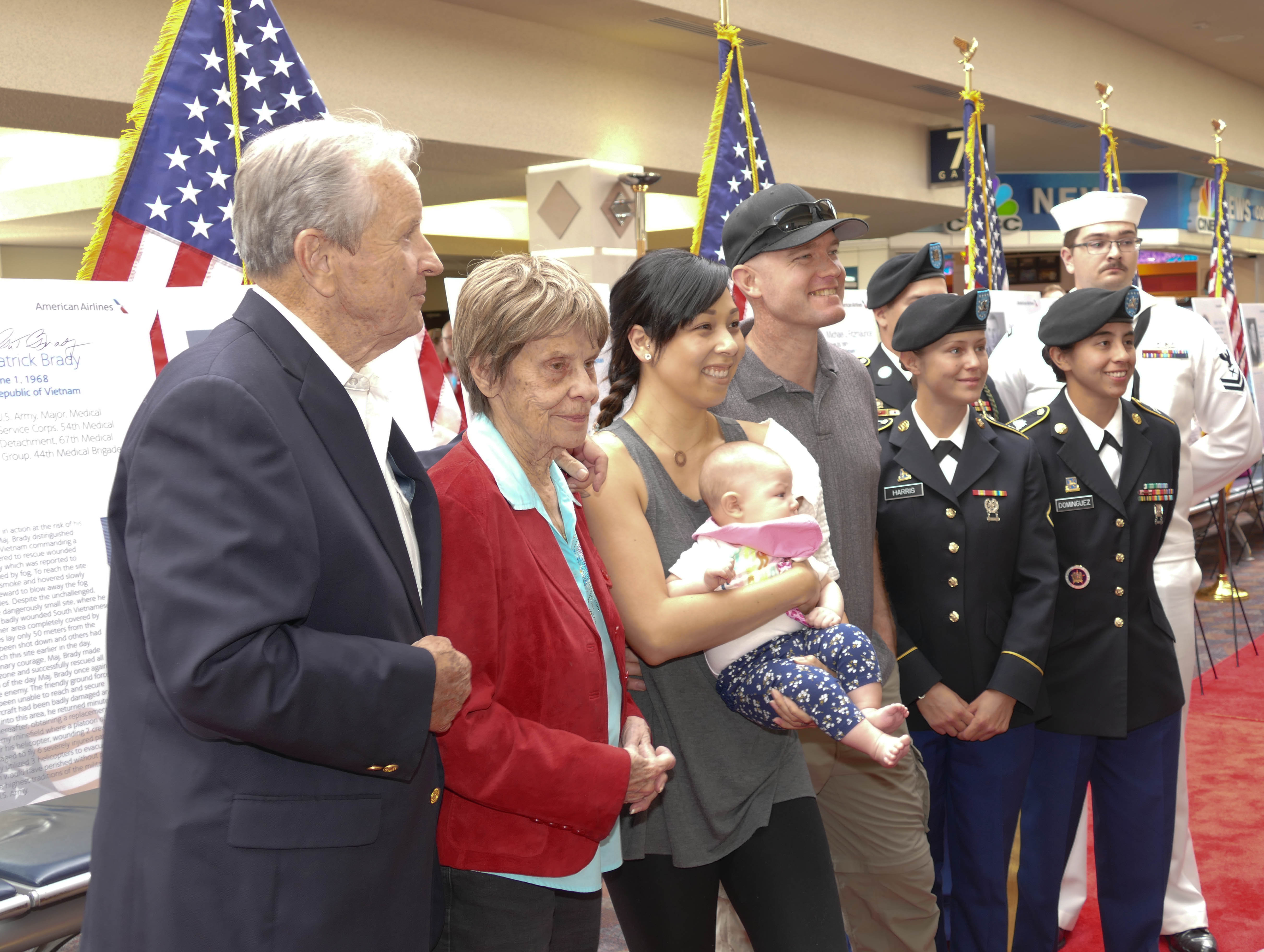 MOH recipient Gen Patrick Brady and his wife Nancy are greeted by fans