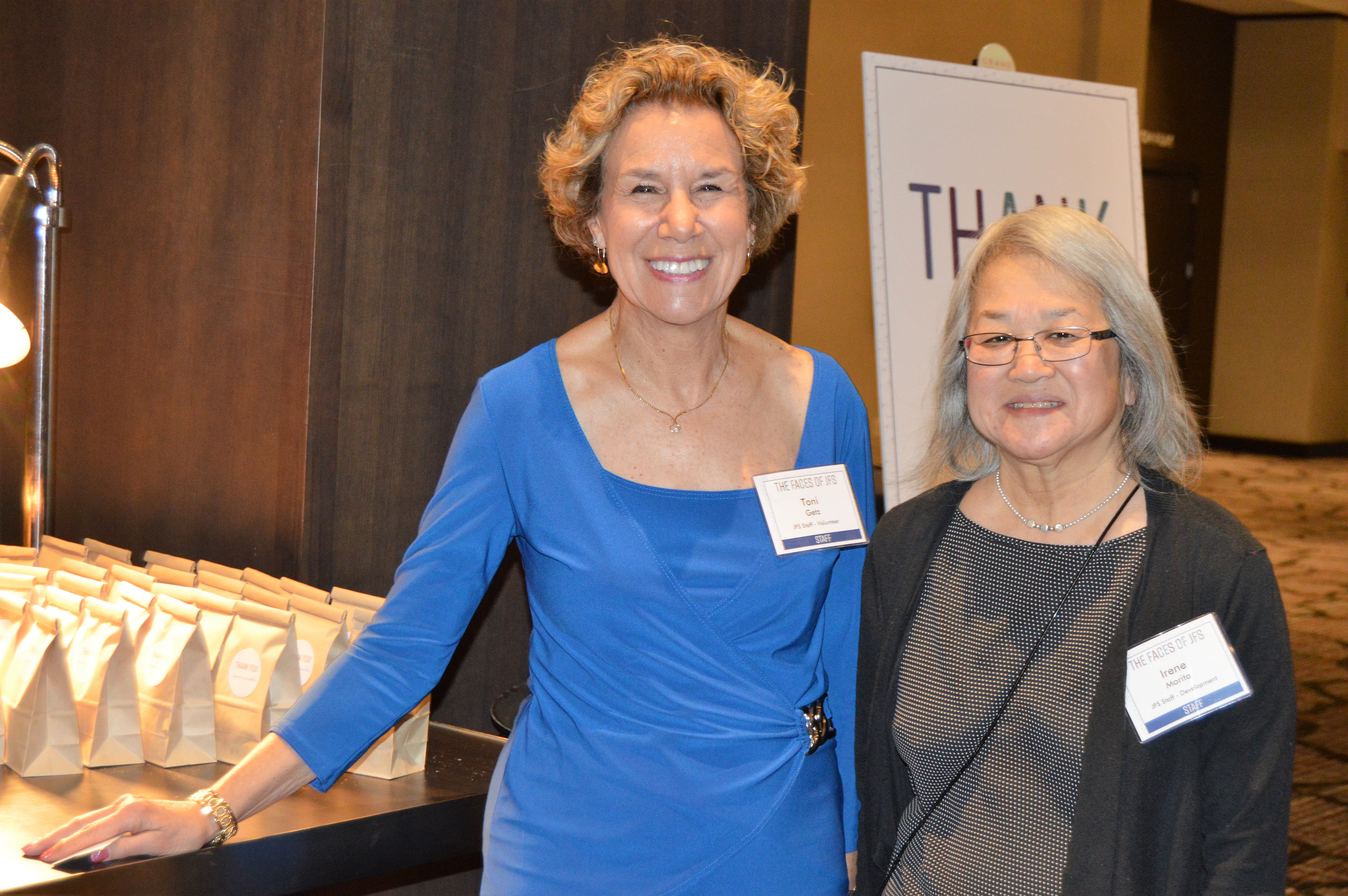 Toni Getz and Irene Morita man the doughnuts-to-go table.