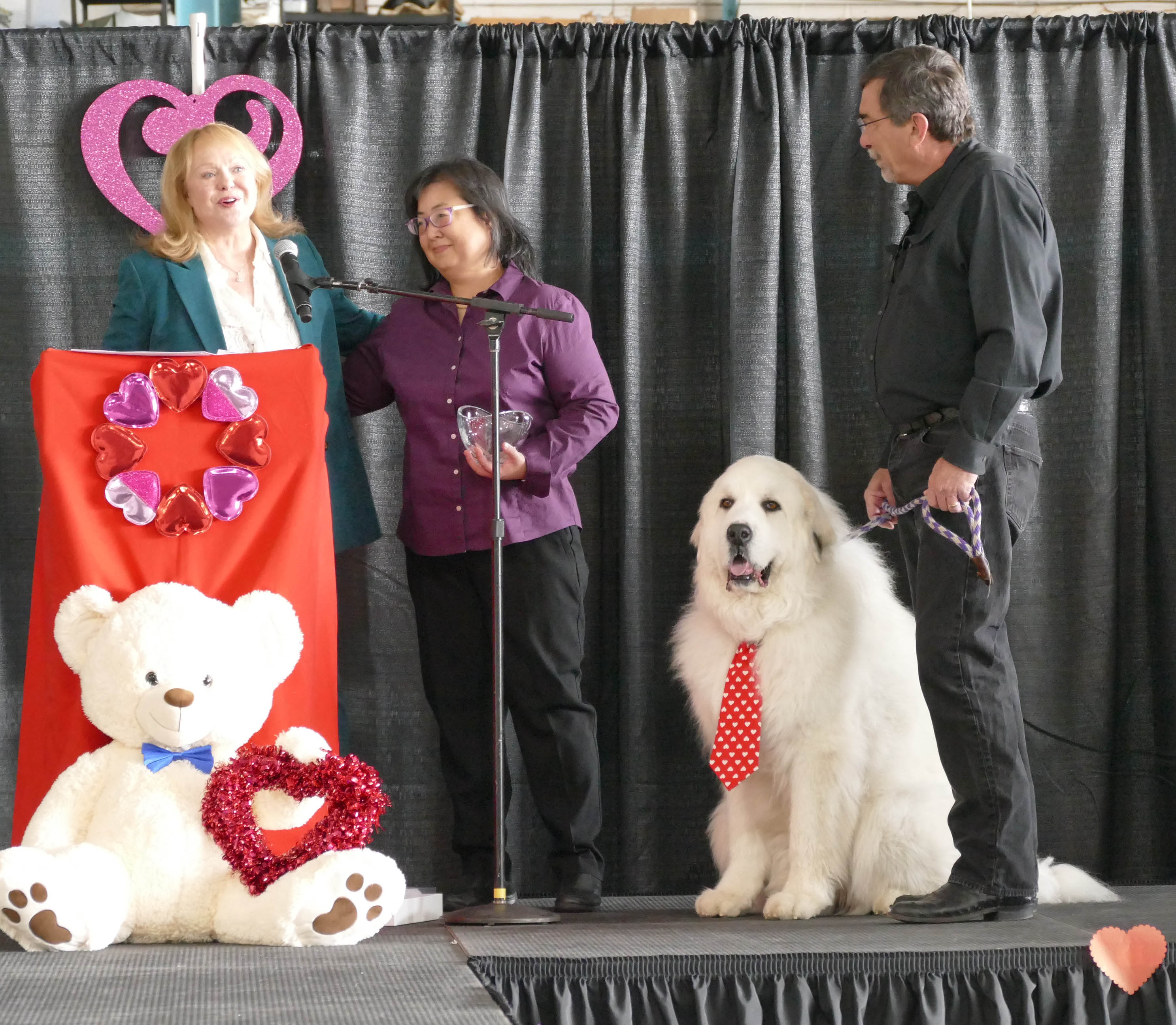 Pam King on stage with Marilee and Ben Doud and Sarge