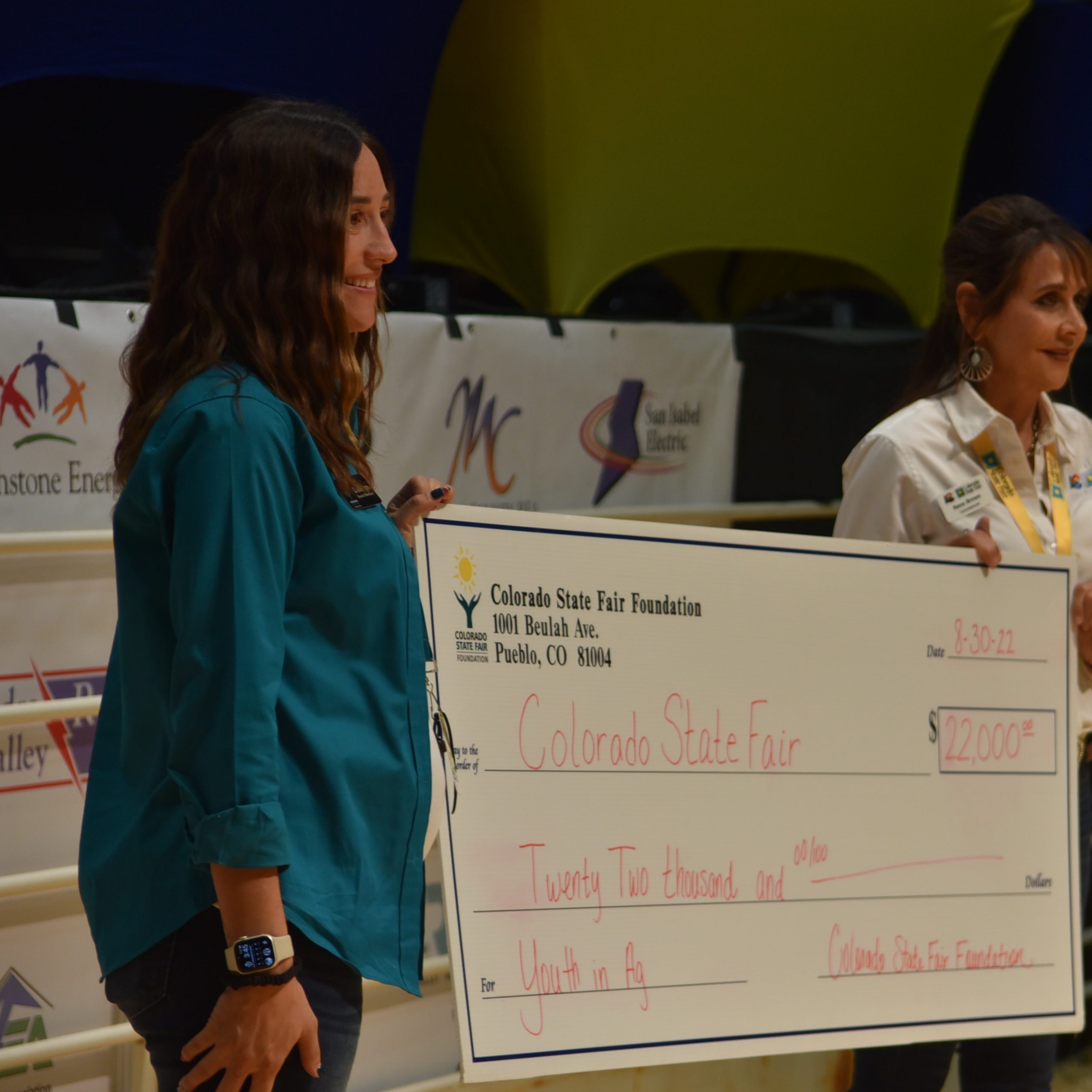 Rene Brown, right, shows of the 22K check from the Brown family