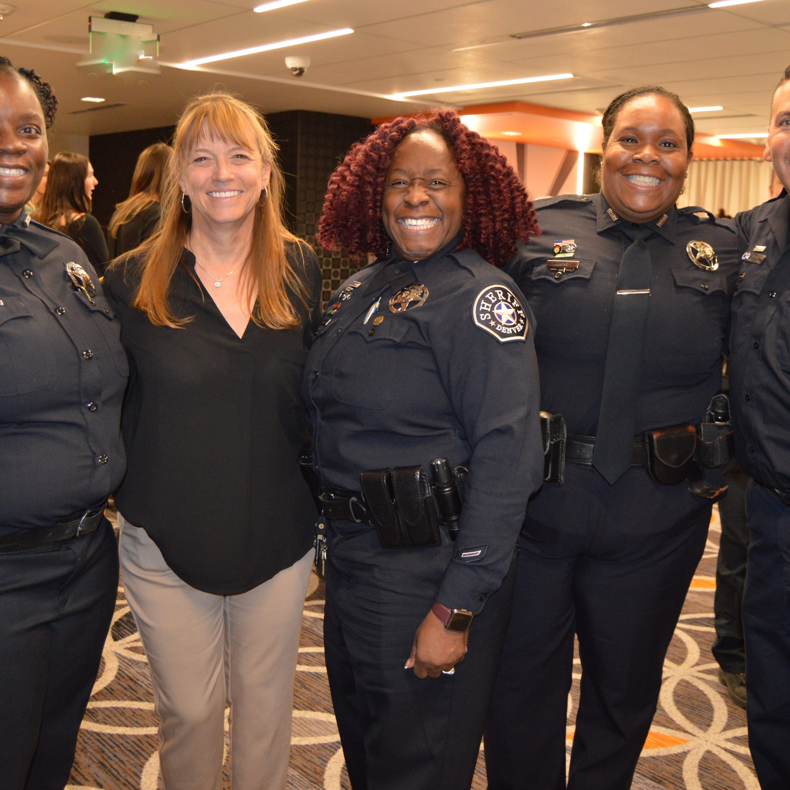 Laura Douglas (second from left), with reps from Denver Sheriff and ...